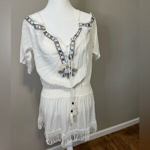 Cold shoulder mini dress with embellished and fringe trim. White